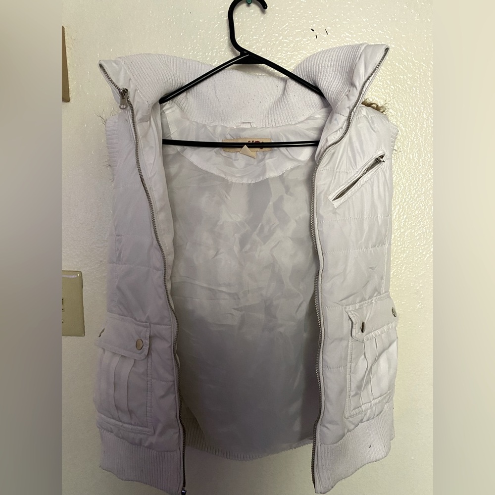 White fur vest